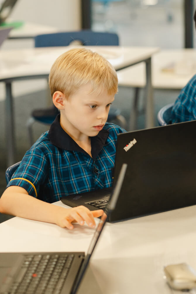 Student with a laptop computer - Mancel College - Brisbane