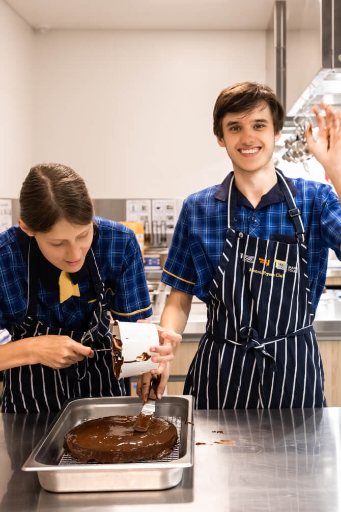 Two students making a cake - Mancel College - Brisbane